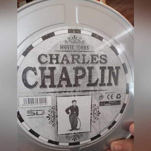 Movie Icon's Charlie Chaplin still in tin box plastic is a little warped. - Picture 1 of 2